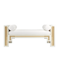 White upholstered 59-inch end-of-bed bench featuring natural rattan cane panels, painted solid wood frame and two cylindrical white bolster pillows in a boho-Scandinavian style.