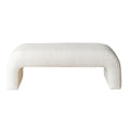 White boucle-upholstered end-of-bed bench with a low, armless silhouette, rounded corners and open U-shaped legs, shown against a white background.