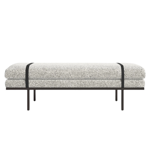 59-inch natural bouclé upholstered end-of-bed bench with stacked cushioned seat, contrasting dark wood base and slim legs, and two black straps running across the cushion.