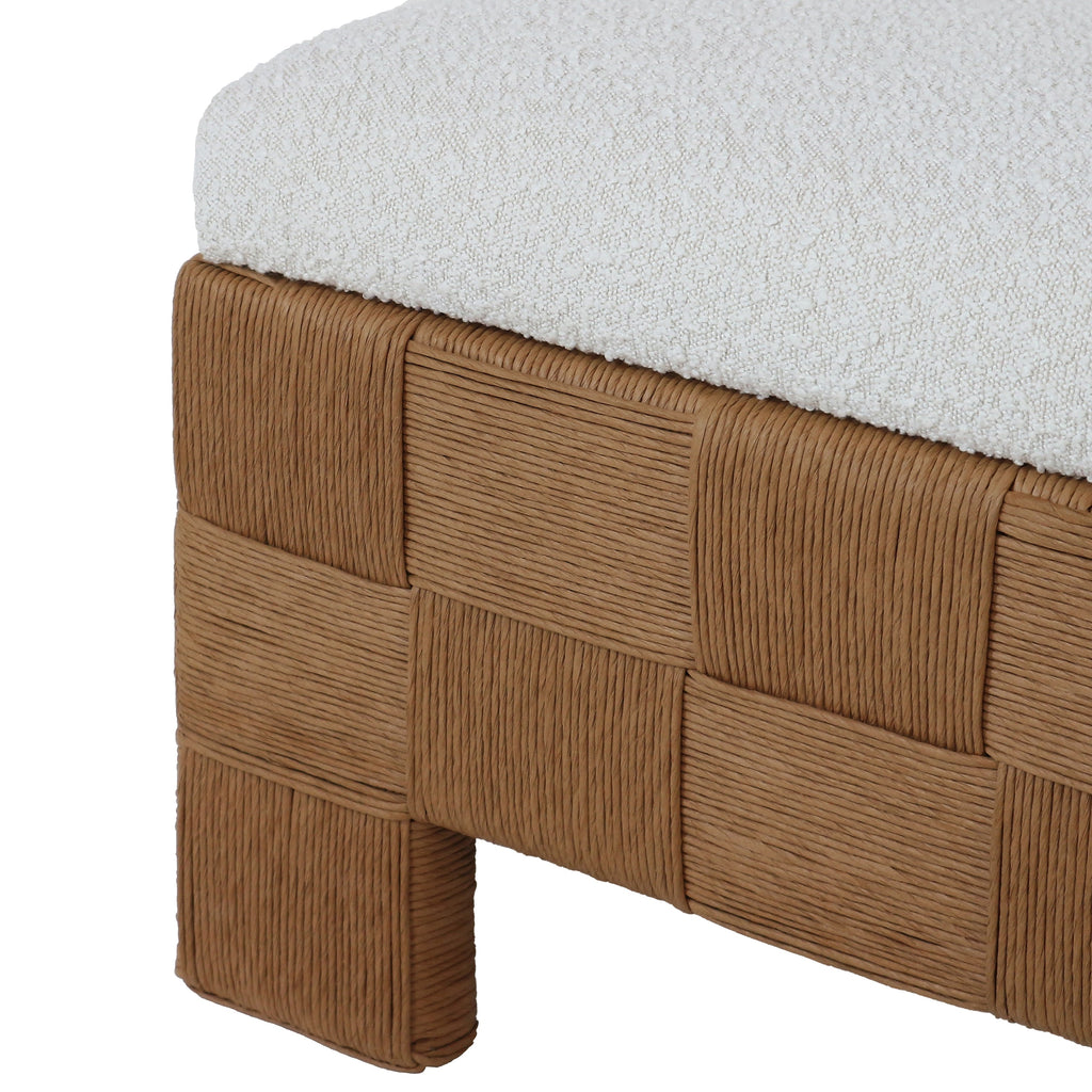 59-inch boucle upholstered bench with a cream fabric cushion set on a woven natural rattan checkerboard base and short rattan feet, low-profile boho-contemporary end-of-bed or entryway bench.