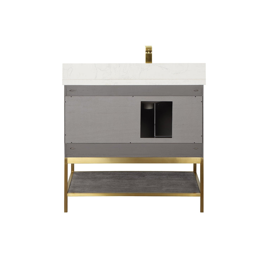 Front view of a 36-inch modern single-sink vanity with a white stone countertop and brass faucet, gray solid-wood cabinet with central plumbing cutout, and an open dark-wood lower shelf on a brass metal base.