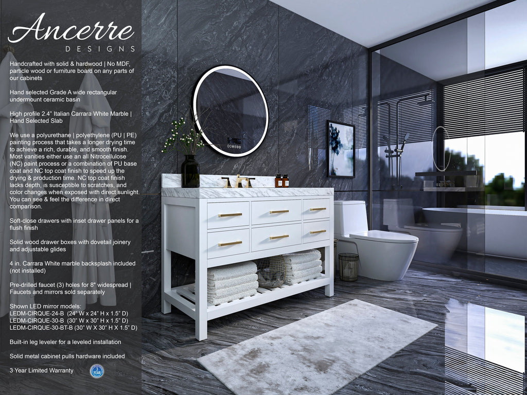 Modern 48-inch white solid-wood single-sink vanity with Carrara stone top, brass drawer pulls and open towel shelf, topped by a round LED mirror; shown against a dark marble wall beside a glass shower and toilet.