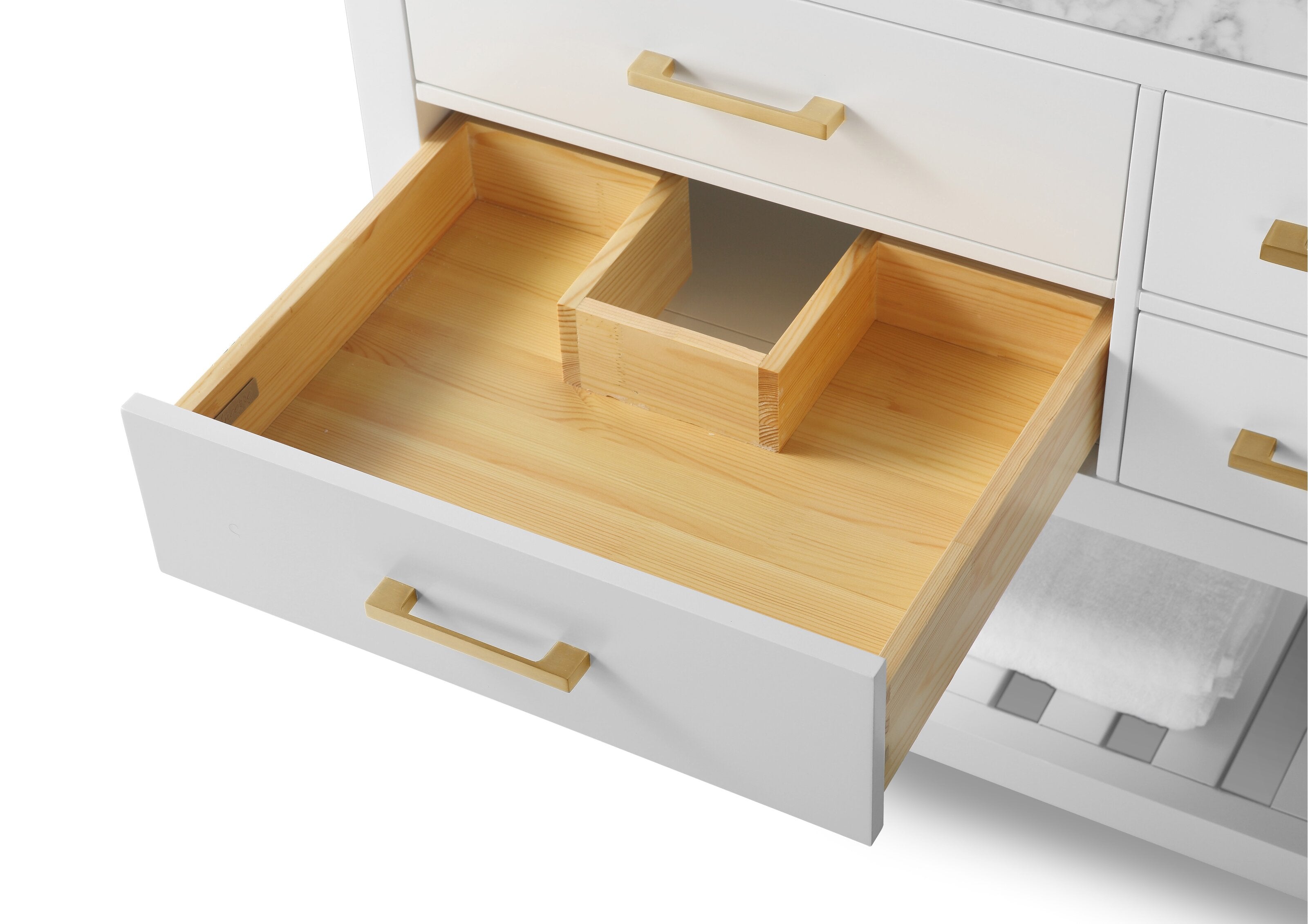 Open drawer of a modern bathroom vanity revealing a natural solid wood interior with a central plumbing cutout, white painted drawer front and brushed-gold handle, with stone countertop edge and adjacent drawers visible.