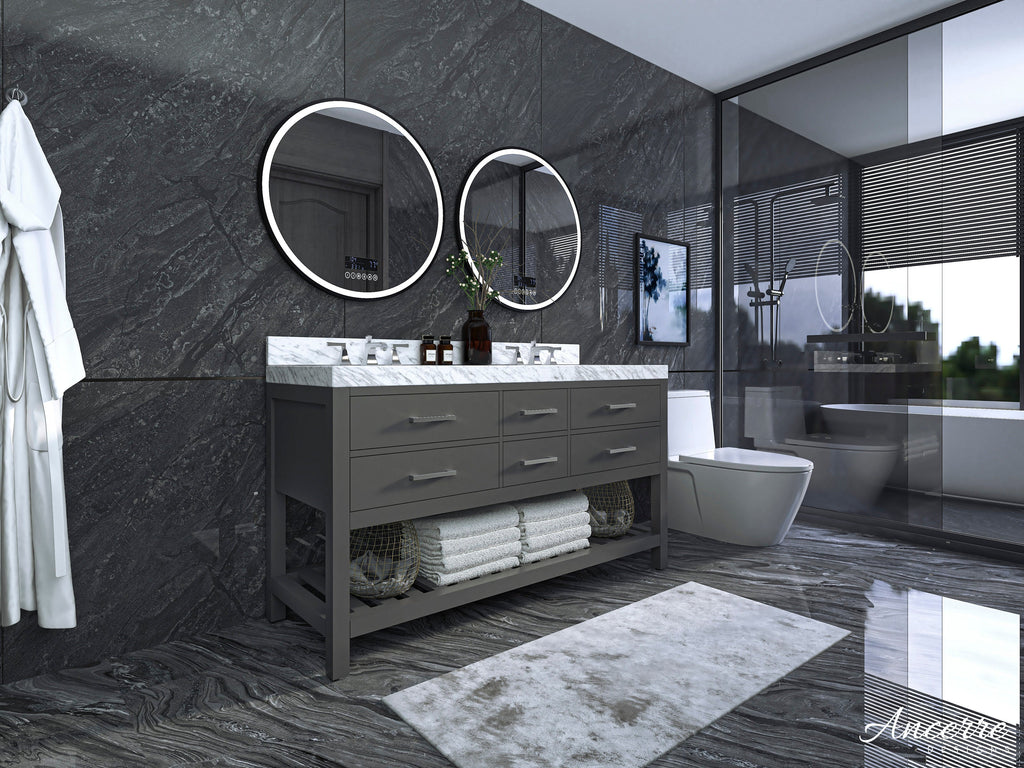 Contemporary 60-inch solid wood double-sink vanity in stone gray with a white veined stone countertop, two round illuminated mirrors, brushed metal pulls and an open lower shelf with towels and baskets.