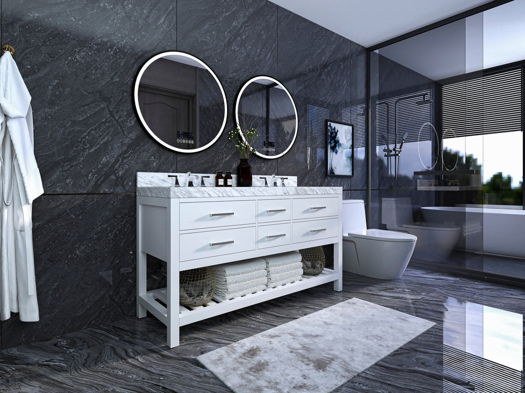 Freestanding white solid-wood 60-inch double sink vanity with stone marble top, chrome faucets, soft-close drawers and open lower shelf with folded towels and baskets, set against dark stone walls with round backlit mirrors and glass shower.