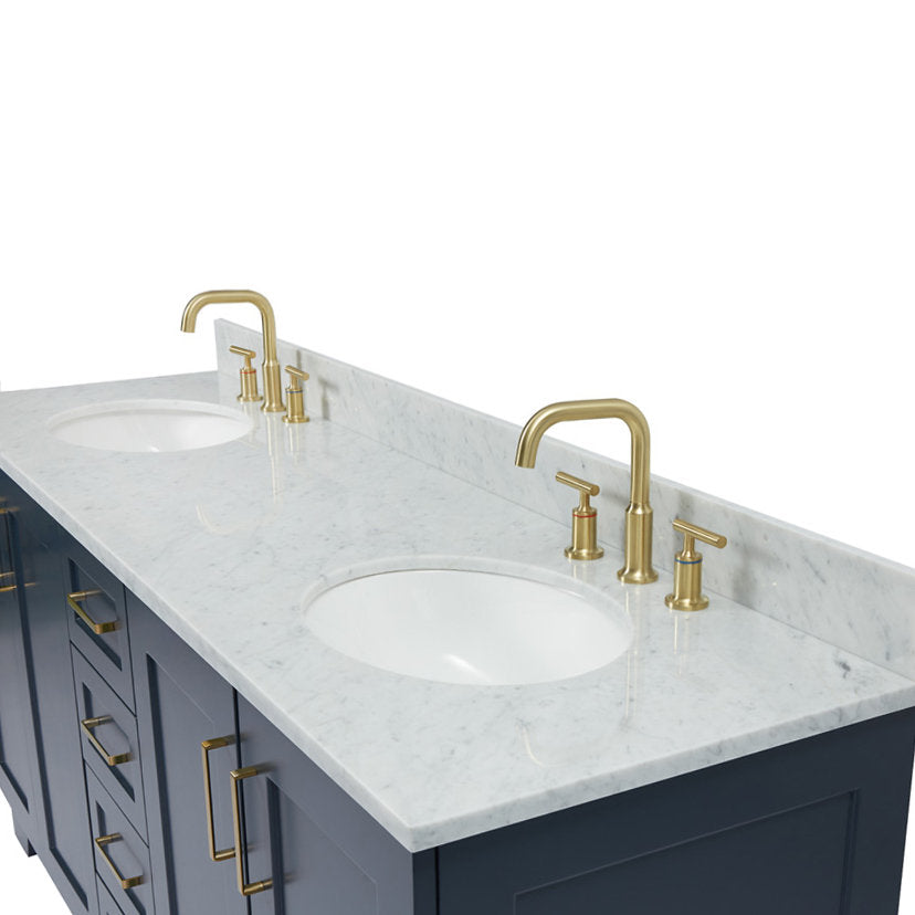 73-inch solid wood double vanity with white stone marble top and low backsplash, two undermount white ceramic sinks, satin-bronze gooseneck faucets and matching bronze bar pulls on navy-gray cabinets.