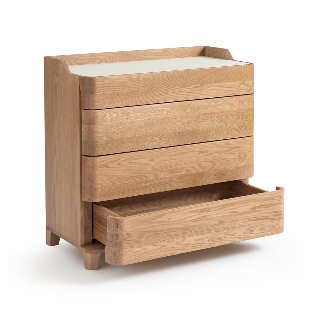 Contemporary blonde solid wood dresser with a white linoleum top, three rounded-front drawers and one lower drawer pulled open, showcasing light natural wood grain and short tapered legs.