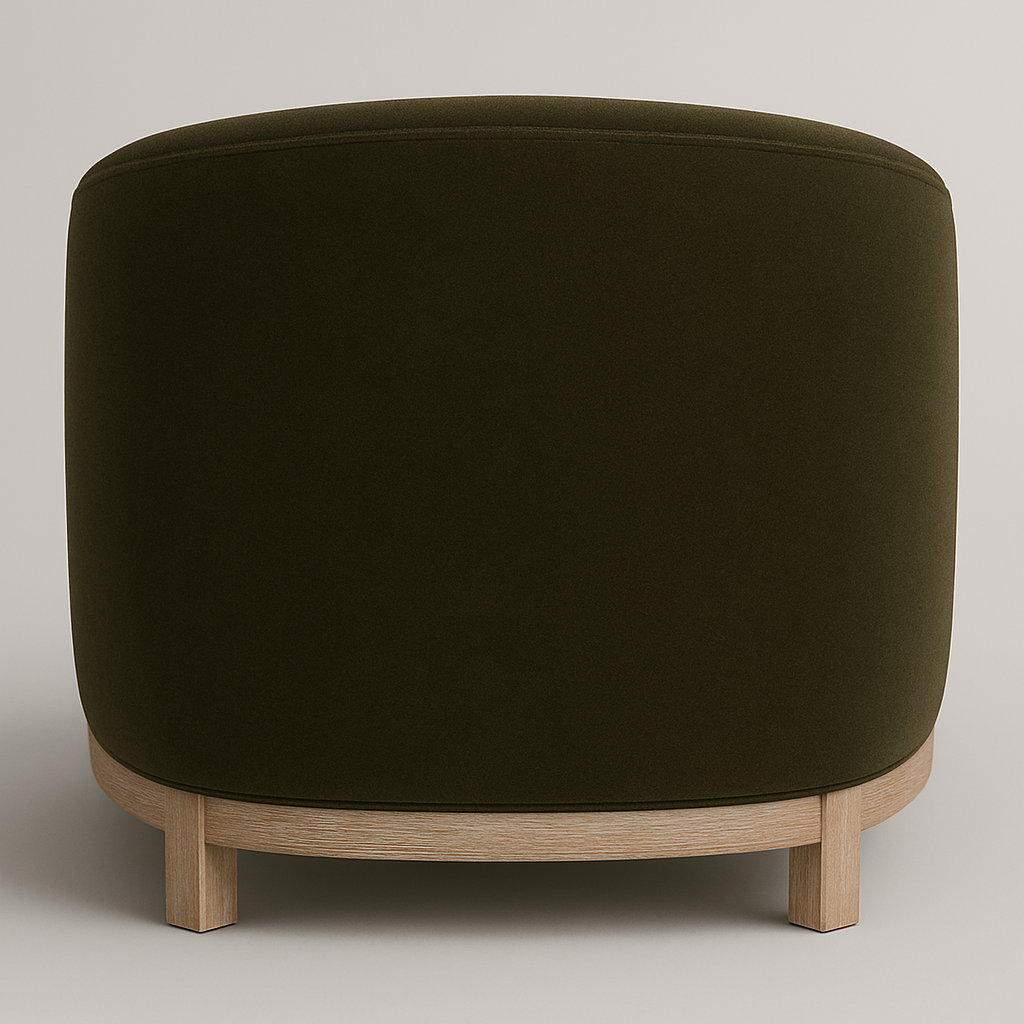 Rear view of an olive green velvet barrel-back accent chair featuring a rounded upholstered back and a natural wood base with short block legs in a modern contemporary style.