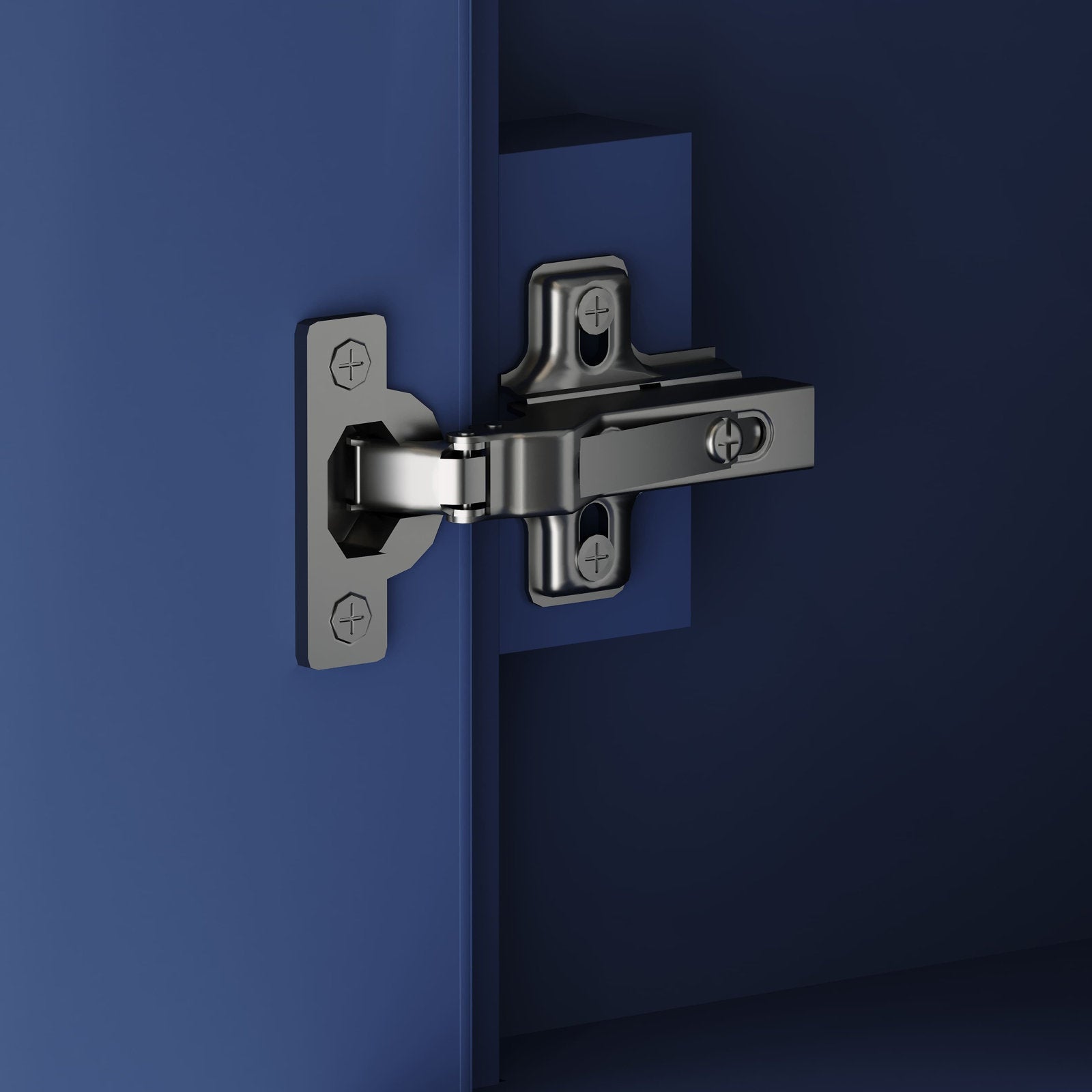 Close-up of a polished metal soft-close cabinet hinge mounted to a modern solid wood vanity door, showing screw heads and the mounting plate against a deep blue background.