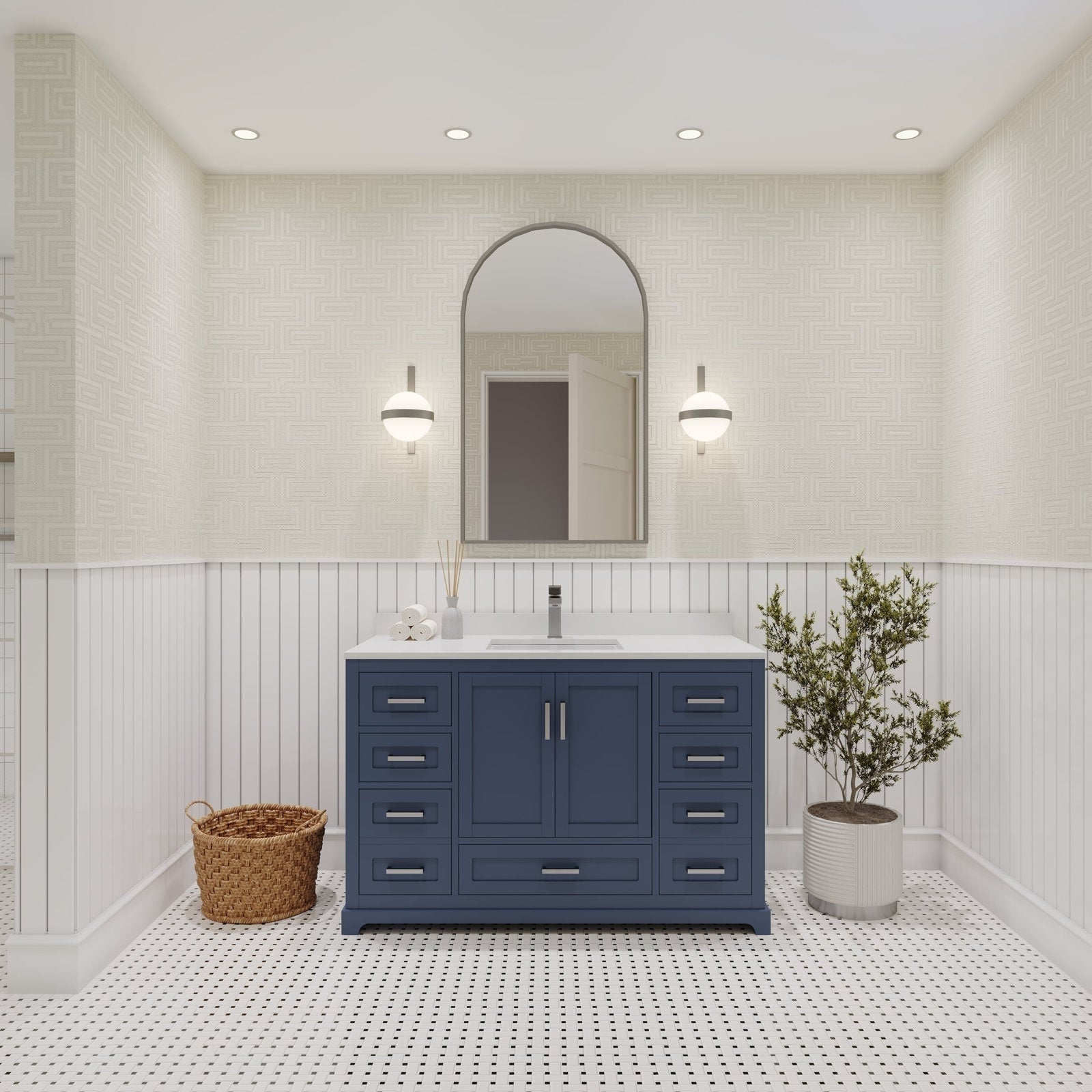 Navy solid wood 48-inch bathroom vanity with a white stone countertop and single ceramic sink, brushed metal pulls and soft-close drawers, shown beneath an arched mirror and wall sconces in a contemporary bath.