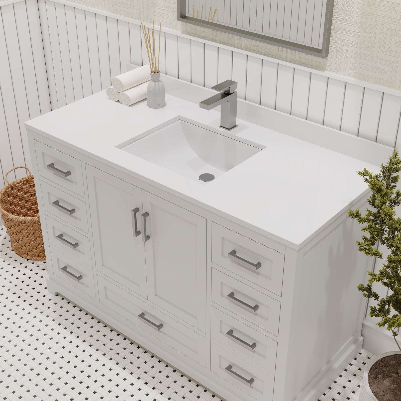 Freestanding 48-inch solid wood bathroom vanity in stone finish with an integrated rectangular ceramic sink, contemporary chrome single-handle faucet, multiple soft-close drawers and center cabinet, styled with rolled towels and a wicker basket.