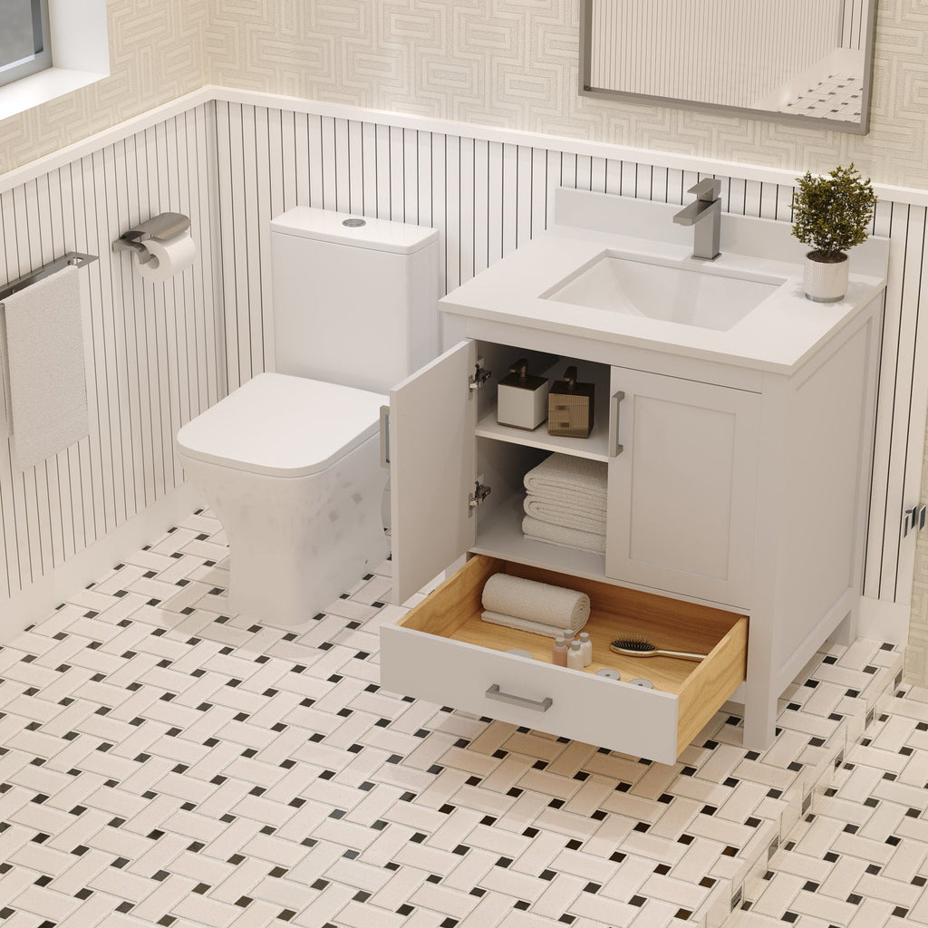 Freestanding modern stone-top solid wood single-sink bathroom vanity in stone finish with an undermount sink, open cabinet shelving and a wood-lined drawer holding towels and toiletries beside a white toilet.