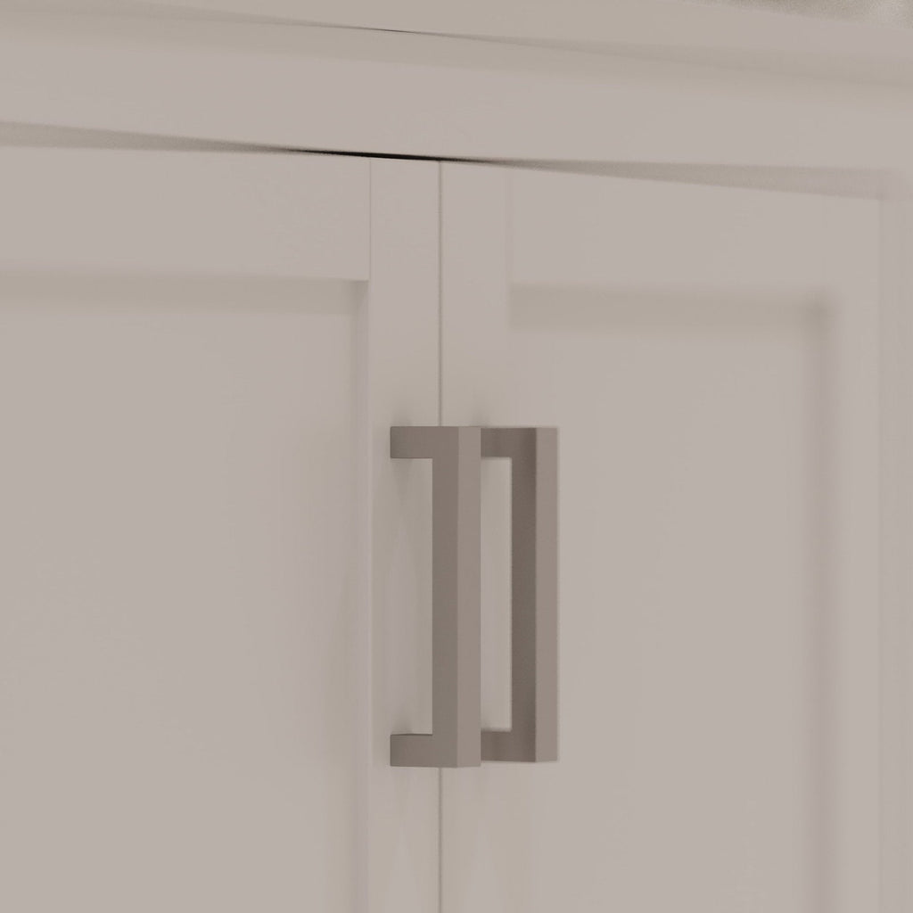 Close-up of a stone-colored bathroom vanity double door showing a modern rectangular matte-gray metal pull handle mounted on recessed solid wood panels.
