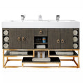 59-inch freestanding double-sink bathroom vanity with a white stone composite top and integrated rectangular sinks, stone-colored solid wood cabinet, gold metal base and square gold pulls, open shelves with rolled towels.