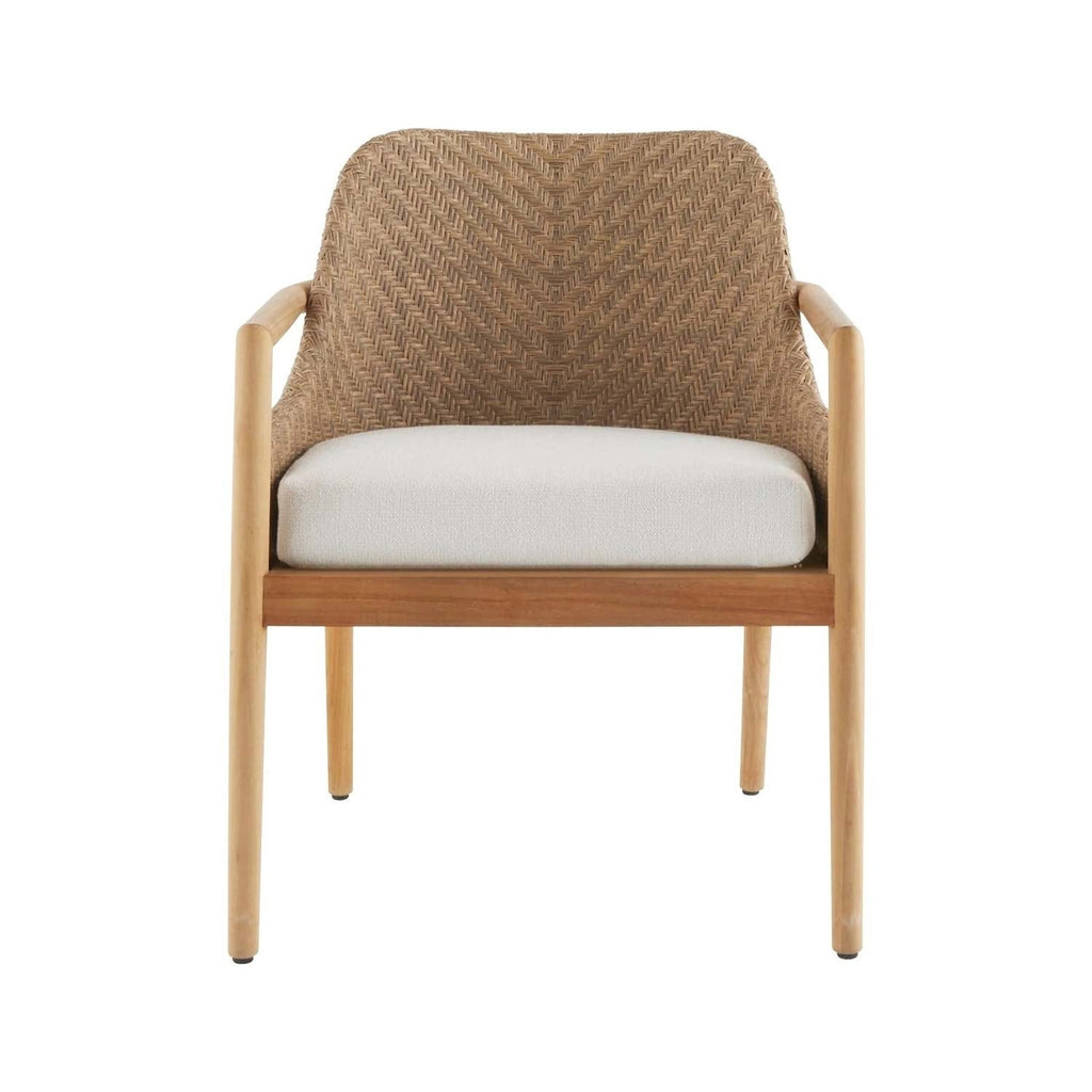 Front view of a coastal-style outdoor dining chair with a natural teak frame, rounded wooden arms, woven wicker chevron back and an off-white upholstered seat cushion.