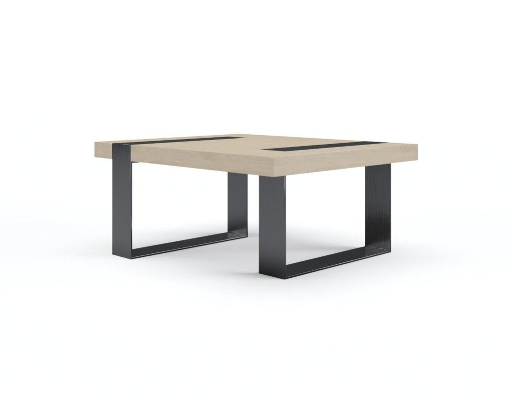 Minimalist block coffee table with a thick natural oak top, two inset black steel strips and paired black rectangular U-shaped steel legs on a white background.