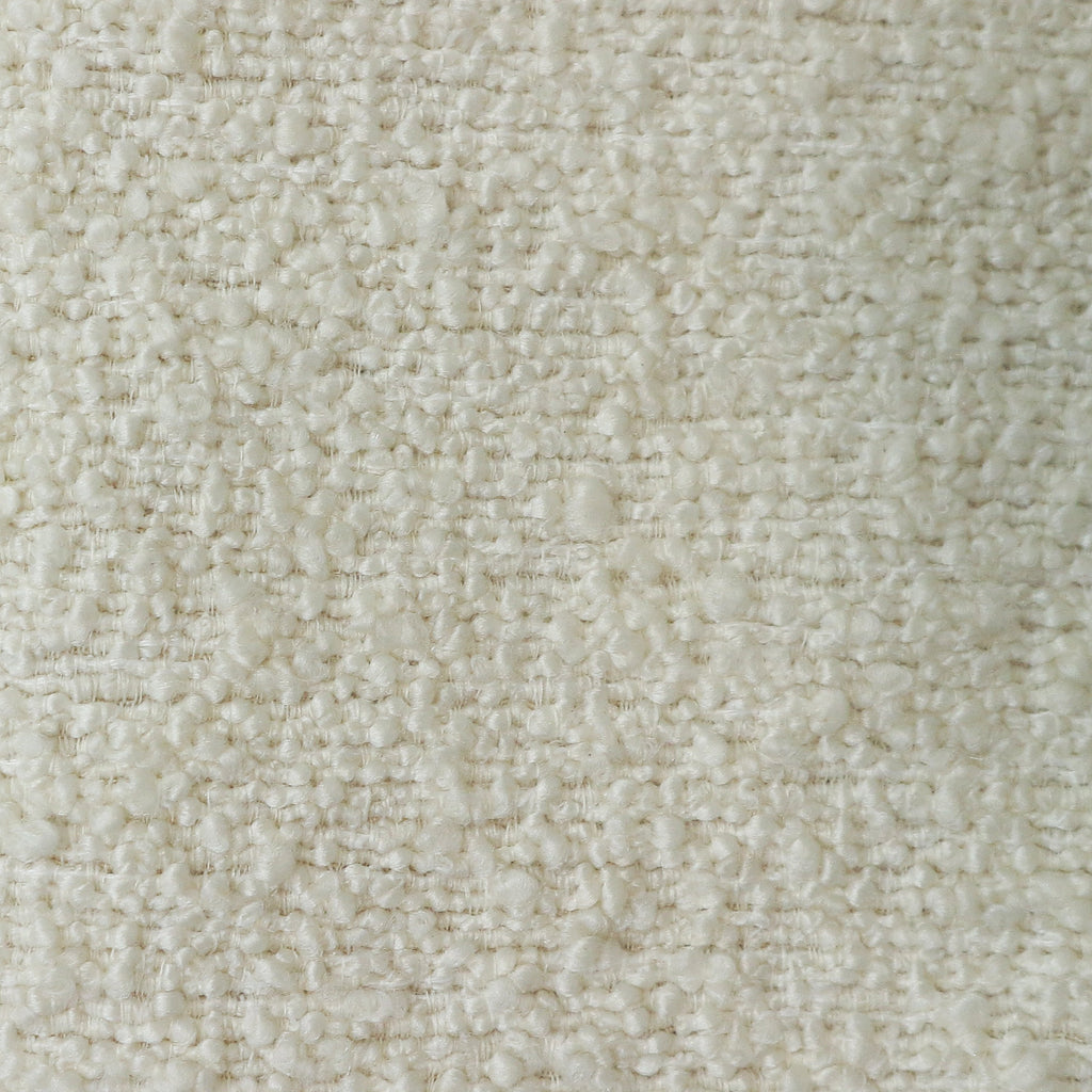 Close-up of cream boucle upholstery fabric showing soft nubby loops and woven texture in a neutral tone, ideal for modern upholstered dining chairs.
