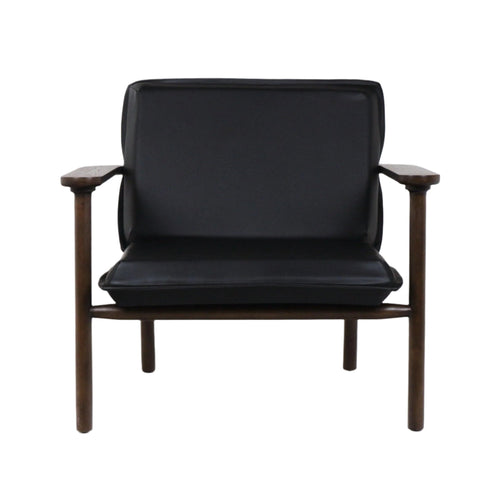 Front view of a modern mid-century lounge chair with black faux leather seat and back cushions on a warm solid wood frame with exposed armrests and round legs.