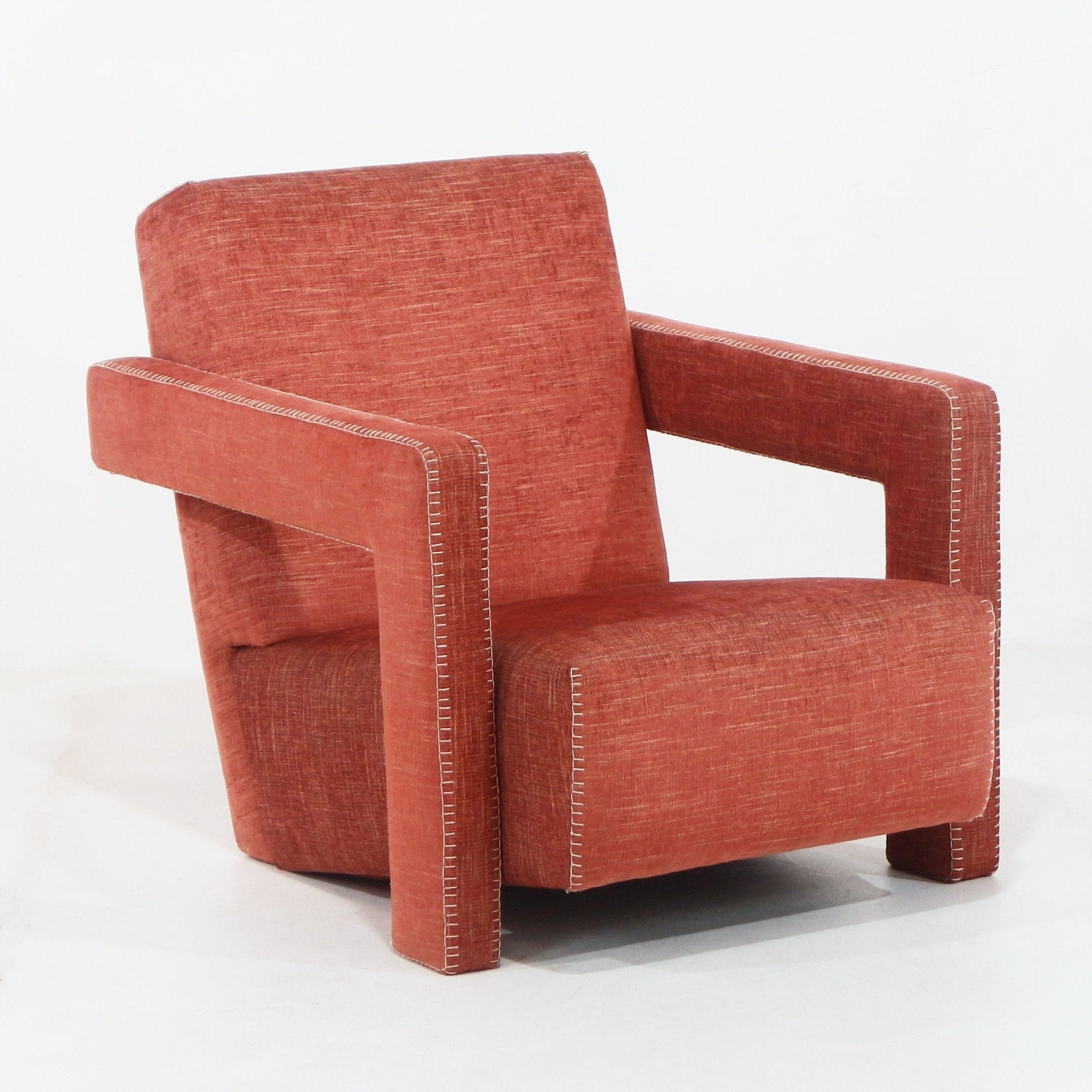 Modern cabernet fabric lounge chair with blocky open rectangular arms, full low back, white contrast topstitching and short wooden legs.
