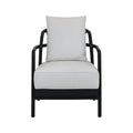Front view of a mid-century modern armchair with a dark solid teak wood frame and light beige fabric seat and loose back cushion, rounded armrests and low-profile legs.