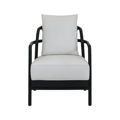 Front view of a mid-century modern armchair with a dark solid teak wood frame and light beige fabric seat and loose back cushion, rounded armrests and low-profile legs.