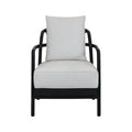 Front view of a mid-century modern armchair with a dark solid teak wood frame and light beige fabric seat and loose back cushion, rounded armrests and low-profile legs.