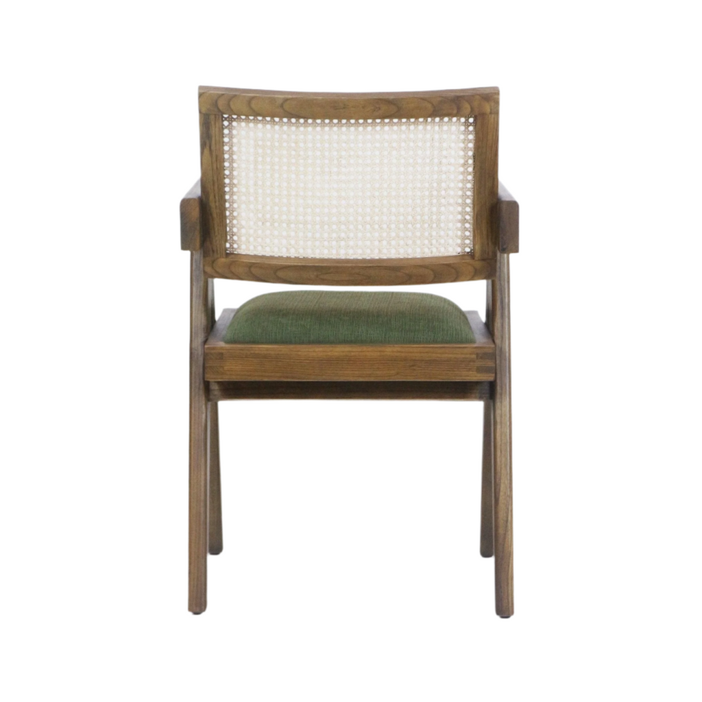 Rear view of a mid-century modern dining chair with a natural wood frame, woven cane backrest, short wooden arms and a green upholstered fabric seat cushion.