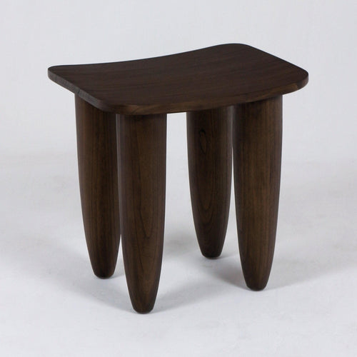 Small modern solid mahogany side table with a gently curved rectangular top and four rounded, tapered legs in a dark mahogany finish on a plain white studio background.
