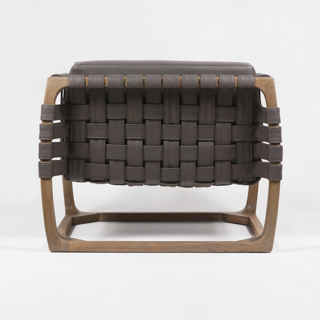 Back view of a modern lounge chair with dark brown webbed leather straps woven in a basket pattern and a light natural solid wood frame, shown on a plain white background.