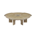 Low round coffee table in natural blonde oak with a woven cane top divided into radial panels around a carved central hub, supported by short solid oak legs for a modern, mid‑century look.