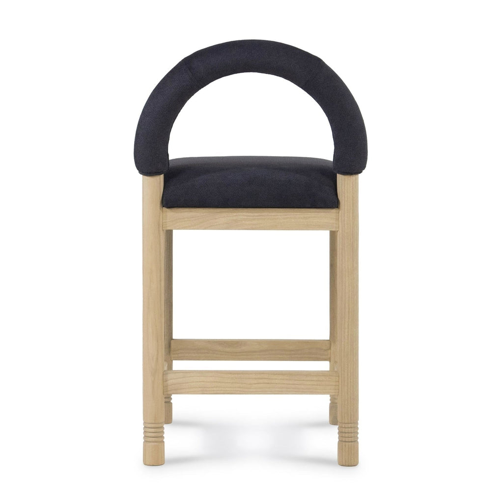 Front view of a bar/counter stool with a natural oak frame and low arched back upholstered in charcoal bouclé fabric, padded seat and horizontal oak footrest rails.
