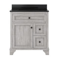 31-inch freestanding single-sink vanity with a black quartz countertop and integrated rectangular sink; solid wood weathered-gray cabinet with a full-width top drawer, one large door, two stacked side drawers and dark square knobs.