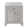 Front view of a modern solid wood bathroom vanity in a whitewashed finish with a white quartz countertop and integrated rectangular sink, one cabinet door and two drawers with dark square knobs.