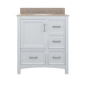 Front view of a 31-inch white solid wood freestanding bathroom vanity with a beige stone top and integrated single ceramic sink, one shaker-style cupboard door and three drawers with modern metal bar handles.