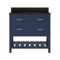 Front view of a navy solid wood single-sink bathroom vanity with a black speckled marble top and backsplash, two large drawers with silver bar pulls, and an open slatted lower shelf.
