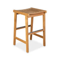 Coastal-style backless teak outdoor bar stool with a slatted, gently curved seat in natural teak finish and metal-reinforced footrests, shown on a white background.