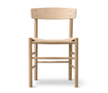 Front view of a Danish-style dining chair in natural oak with a tan woven rope seat, rounded solid-wood legs and a low curved backrest, in a Mid-Century Scandinavian minimalist design.