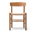 Front view of an armless mid-century modern dining chair in natural teak with a curved solid-wood backrest, round legs and a tightly woven papercord seat.