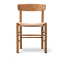 Front view of an armless mid-century modern dining chair in natural teak with a curved solid-wood backrest, round legs and a tightly woven papercord seat.