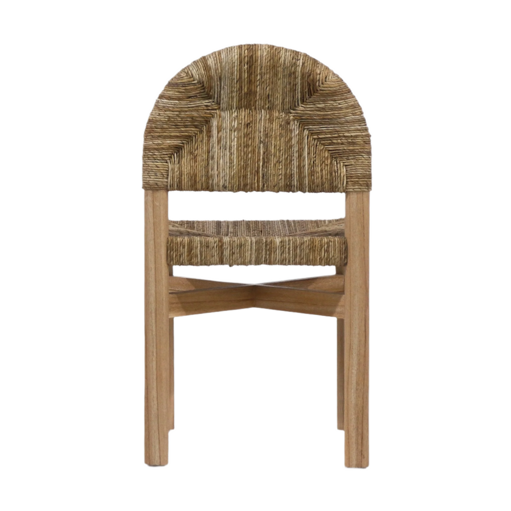 Front view of a coastal dining chair with a solid teak frame, woven natural seagrass seat and arched woven back, featuring crossed stretcher supports and a light teak finish on a white background.