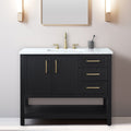 Black solid wood 42-inch freestanding bathroom vanity with white marble stone top, integrated rectangular ceramic sink, brass faucet and hardware, three drawers and open lower shelf against a pale wall.