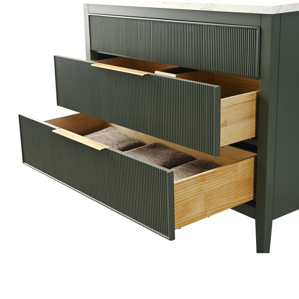 Modern single-sink bathroom vanity with a stone top and stone-colored ribbed front, two open drawers showing natural solid wood interiors and neatly folded brown towels.