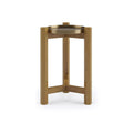 Contemporary teak tripod side table with solid wood legs and a round gold-brass tray top with raised rim, shown on a clean white background.
