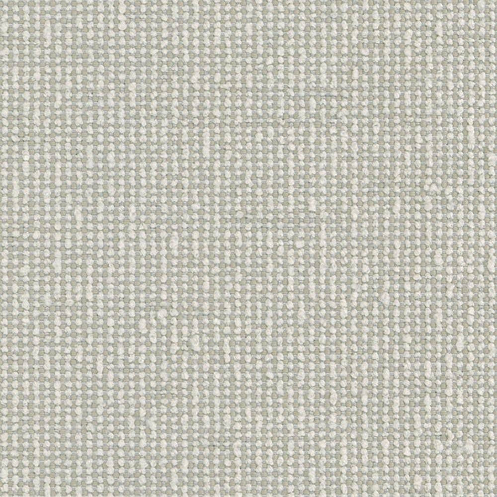 Close-up of neutral beige 100% polyester upholstery fabric showing a tight woven texture with small looped yarns, ideal for indoor sofas and heavy-duty use.