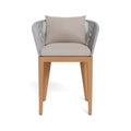 Front view of a coastal outdoor bar stool with a teak wood frame and tapered legs, gray woven-rope curved back and beige upholstered seat with a matching back cushion.