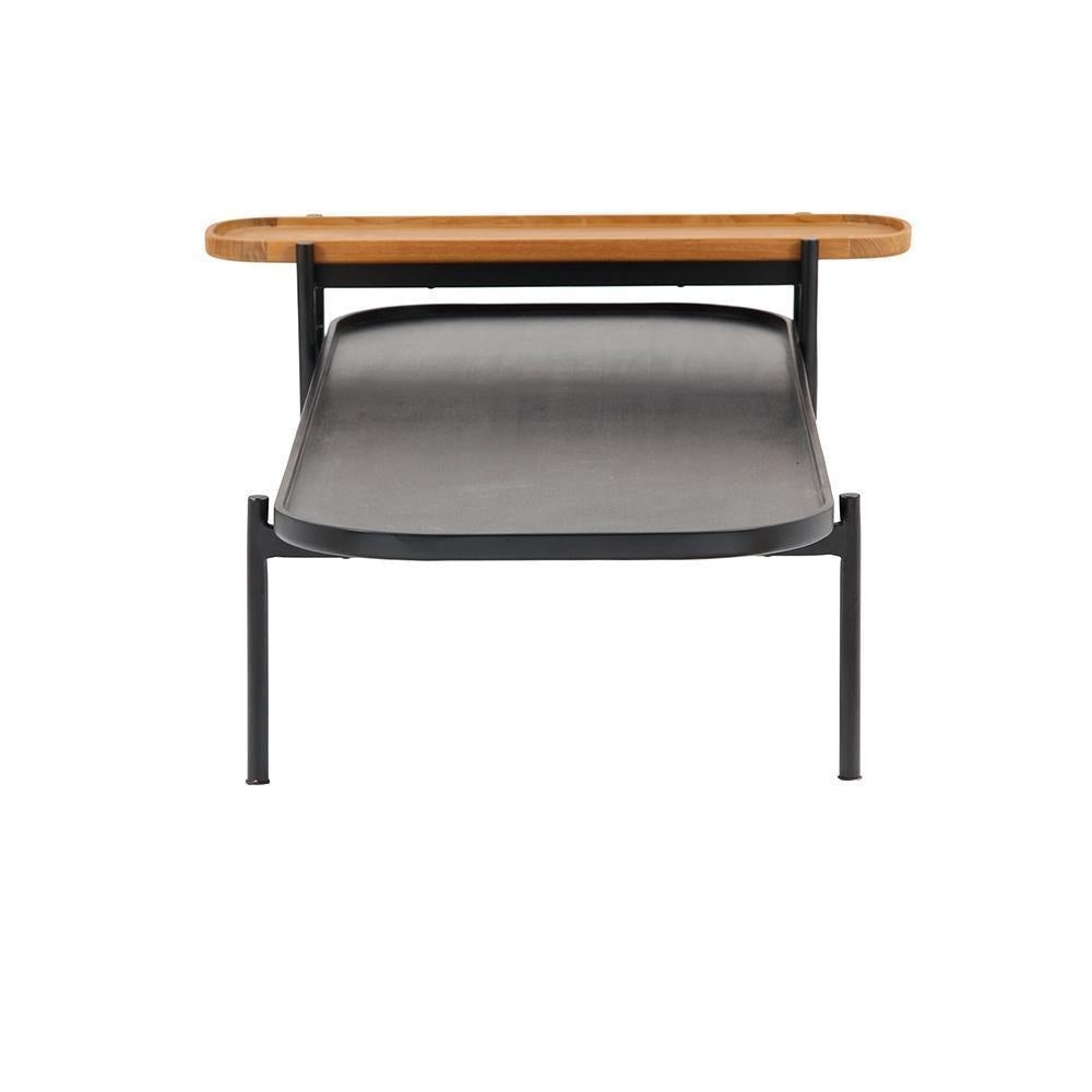 Front view of a modern twin coffee table with a black metal frame, recessed black lower shelf and raised natural teak top tray, shown against a white background.