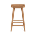 Front view of a backless solid teak outdoor bar stool with a gently contoured natural teak seat, tapered legs and three horizontal stretchers, finished for coastal patio or outdoor bar seating.