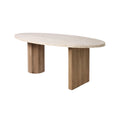 Modern oval travertine dining table with a light beige stone top and natural oak pedestal legs — one round column and one rectangular slab.