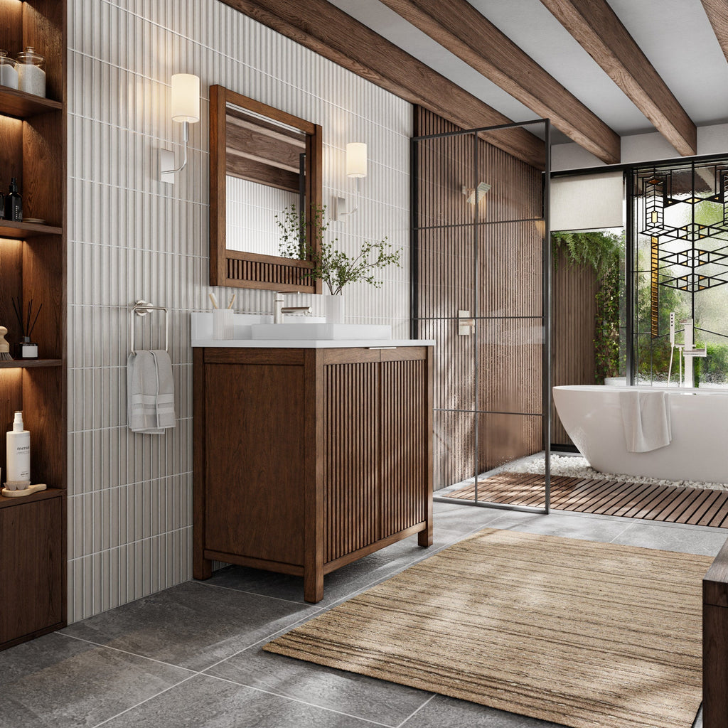 Modern solid wood 36-inch bathroom vanity with fluted cabinet doors and a stone top holding a white ceramic sink, shown with a wood-framed mirror, wall sconces, glass shower partition and a freestanding tub in a warm natural-wood bathroom.