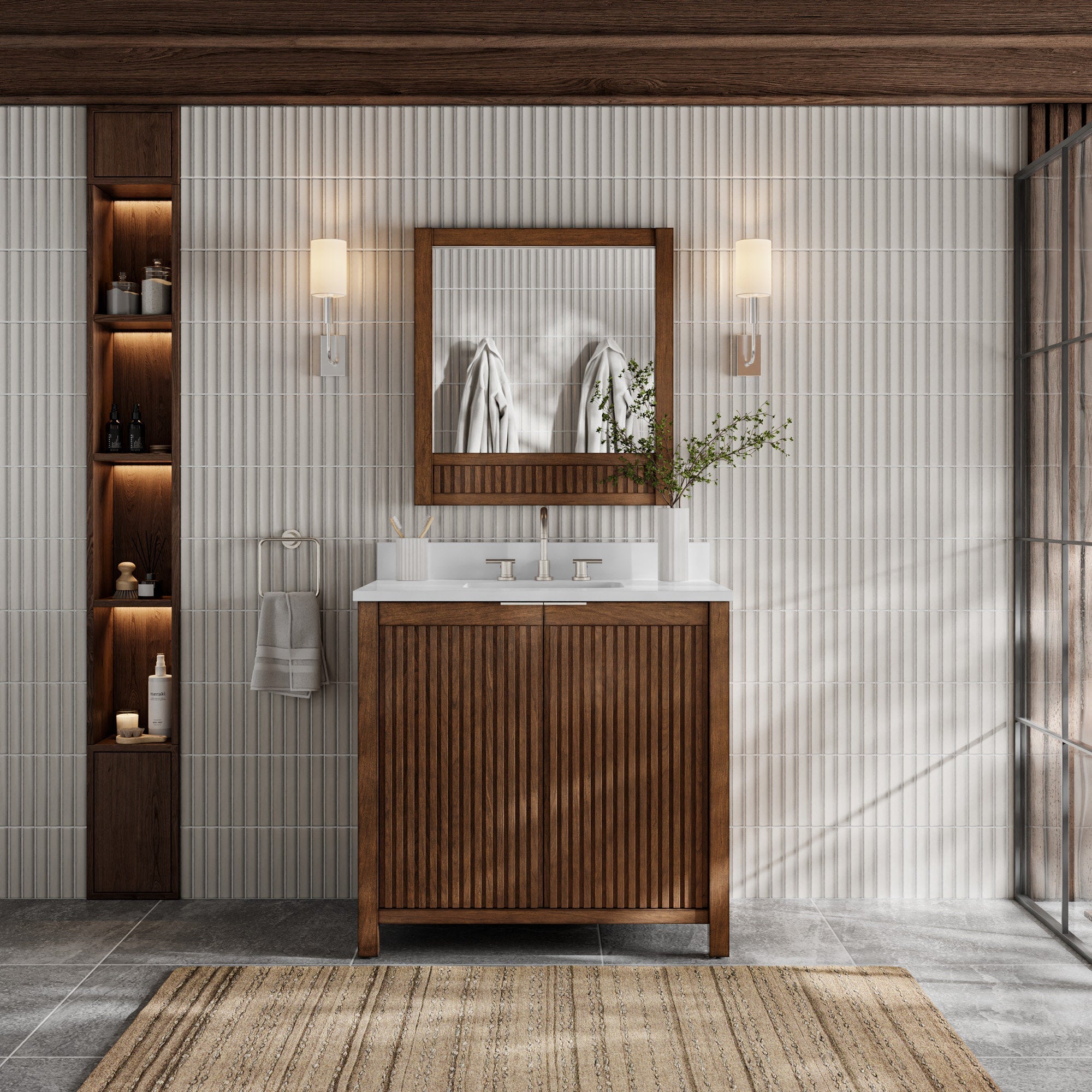 Modern solid wood single-sink bathroom vanity with fluted cabinet doors and stone top, wood-framed mirror, metal faucet, wall sconces and illuminated recessed shelving against a vertical stone-tile wall.